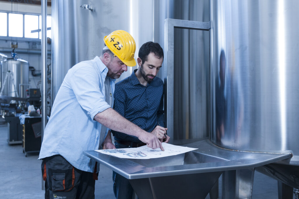 Company team in front of innovative food processing plants, representing technical expertise and innovation
