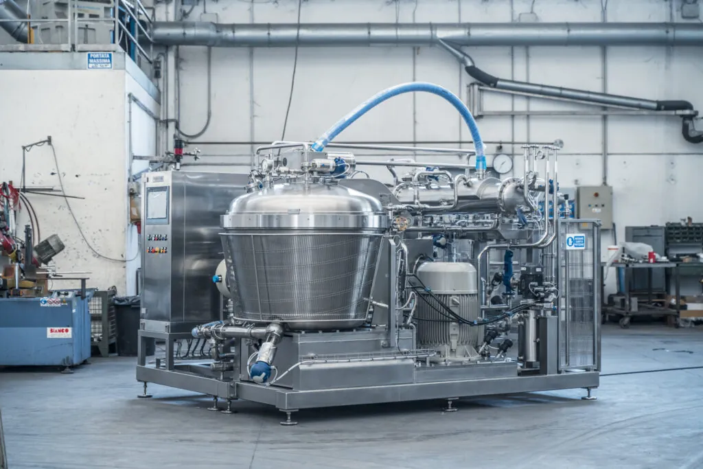 Modern food processing plant with automated systems, skilled operator, and digital monitoring of production processes